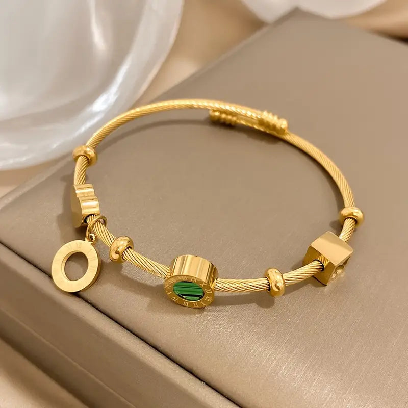 Aurelia – Emerald Charm Gold Bracelet